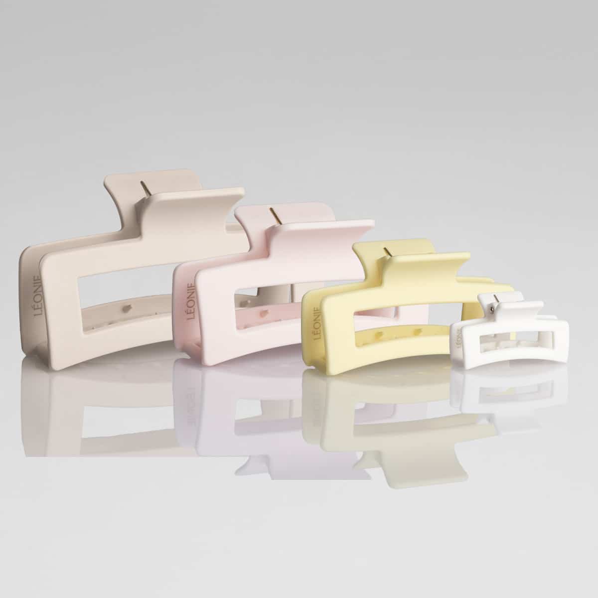 Fyra storlekar med hårklämmor för alla hårtyper i Ljusbeige, rosa, ljusgul och vit